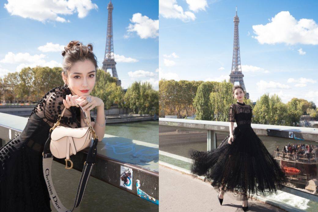 巴黎2019春夏時裝周期間，一身Dior仙氣黑色透視長裙的Angelababy (楊穎)，手挽近來大