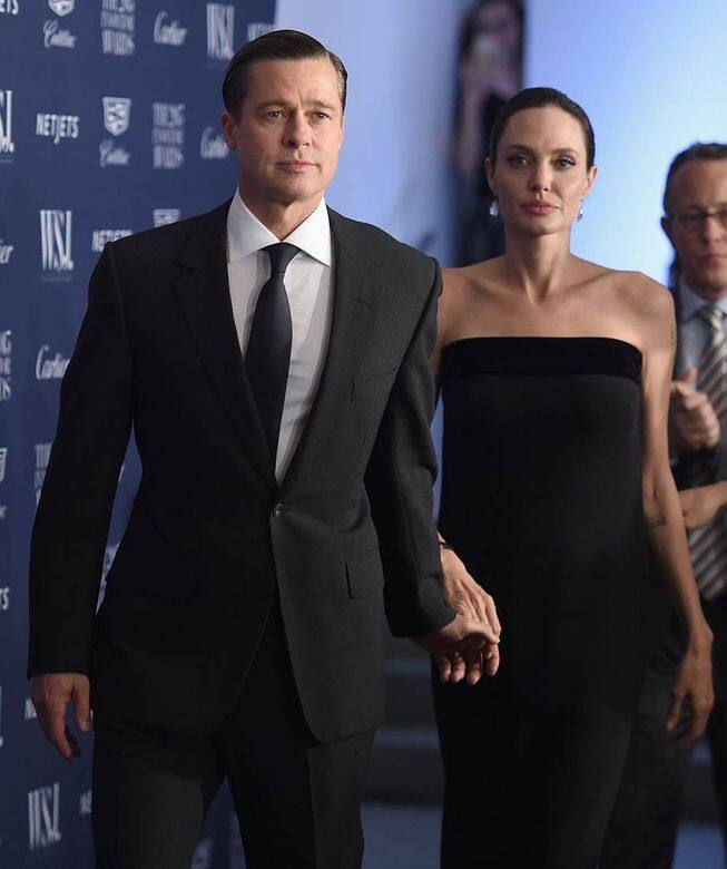 Black Tie穿搭的Brad Pitt與Angelina Jolie。 Black Tie穿搭的Brad Pitt與Angelina Jolie。