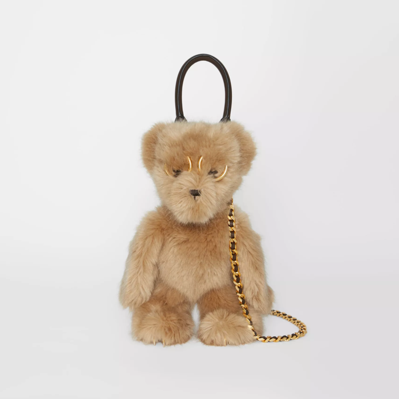 這款可愛的Teddy Bear人造皮革手袋，搭配超大的金屬眼鏡與爪子，毛茸茸的外