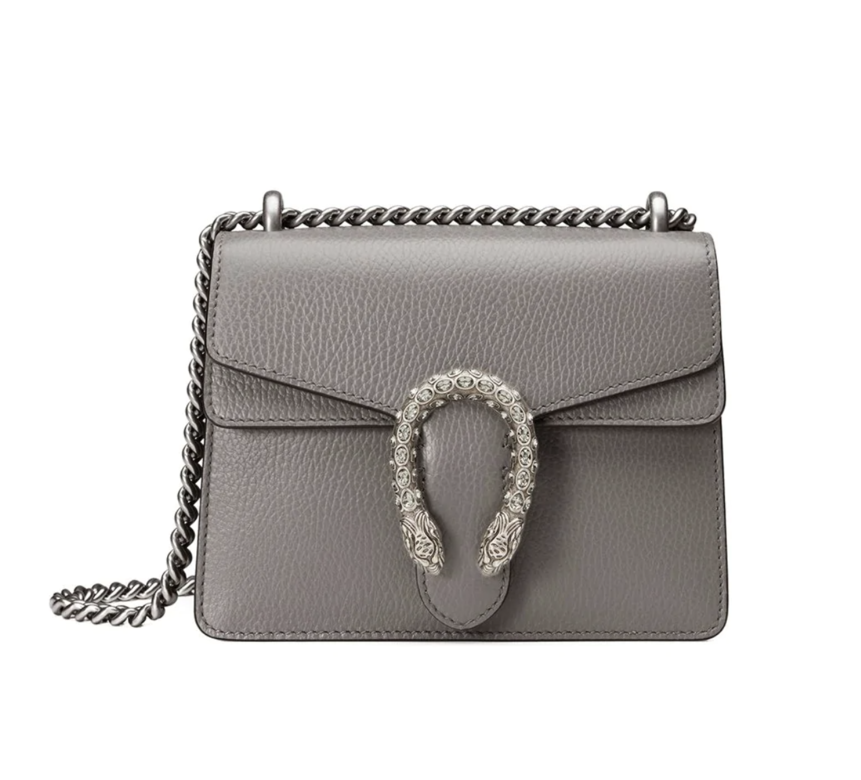 Gucci’s signature Dionysus plaque takes centre stage here. Antique effect silver-tone hardware perfectly complements the grey leather, leading to a look that is sleek but still eye-catching Gucci’s signature Dionysus plaque takes centre stage here. Antique effect silver-tone hardware perfectly complements the grey leather, leading to a look that is sleek but still eye-catching