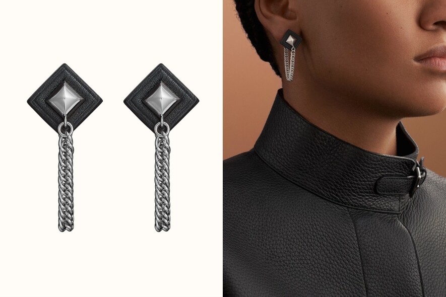 這款型格又不失女人味的Hermès耳環，由小牛皮及金屬製作而成，銀鏈垂墜