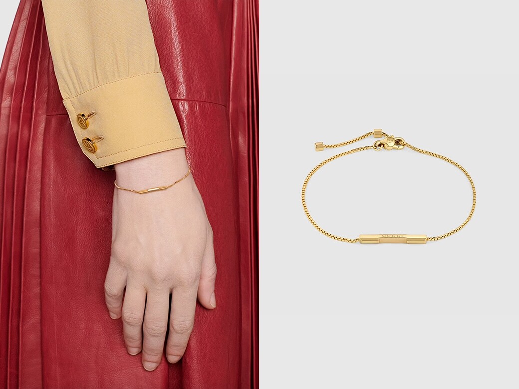 這條Gucci Link to Love的簡約手鍊，採用18K黃金，刻有’Gucci’字樣的長方條吊墜，設計