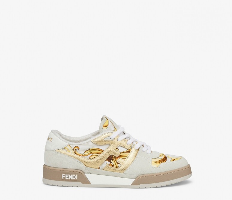 他穿上系列中的Fendace Beige Suede Low-tops波鞋，結合Fendi和Versace的品牌特色，米白、鮮黃和啡